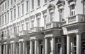 White house fronts with columns and balconies