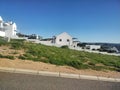 White House green grass pavement blue sky Royalty Free Stock Photo