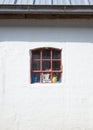 White house with little red window Royalty Free Stock Photo