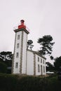 White house and red lighthouse. Brittany, France