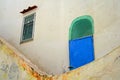 White house wall, facade, with blue door, window with grilles, island of ischia, campania, italy Royalty Free Stock Photo