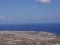 View of the airport and the village of Kamari, aerial view from Mesa Vuono mountain on Santorini island, Greece Royalty Free Stock Photo