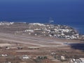 View of the airport and the village of Kamari, aerial view from Mesa Vuono mountain on Santorini island, Greece Royalty Free Stock Photo