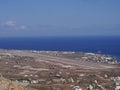 View of the airport and the village of Kamari, aerial view from Mesa Vuono mountain on Santorini island, Greece Royalty Free Stock Photo