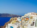 White houses, churches and blue domes in Oia village Royalty Free Stock Photo