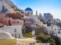 White houses, churches and blue domes in Oia village Royalty Free Stock Photo