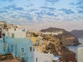 White houses, churches and blue domes in Oia village Royalty Free Stock Photo