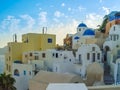 White houses, churches and blue domes in Oia village Royalty Free Stock Photo