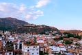 The white houses with tiled roofs are characteristic of Taxco, Guerrero, Mexico.