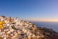 White Houses and Windmills on a Mountainside in Oia Town Royalty Free Stock Photo