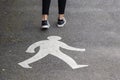 White human shape on asphalt path and teenager feet. Walking foot path and skinny legs of a girl. Outdoor activity and exercise