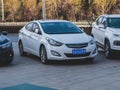 A white Hyundai Elantra sedan family car