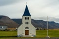 White Icelandic church with blue tower roof