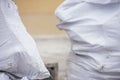 White industrial bags, soft focus