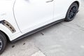 White Infiniti FX35 FX45 FX50 QX70 in Sebastian Vettel Limited Edition tuning side door sills view on the car parking in the Royalty Free Stock Photo