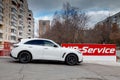 White Infiniti FX35 FX45 FX50 QX70 in Sebastian Vettel Limited Edition tuning side view on the car parking in the street Royalty Free Stock Photo