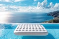 White inflatable mattress floating in infinity pool of luxury hotel with breathtaking sea view Royalty Free Stock Photo