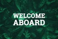 White inscription: welcome aboard, on a green natural background. Concept for motivating background, business, self-development