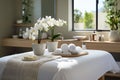 White interior of beautiful, relaxing SPA area in a light room with towels, orchid. Copy space Royalty Free Stock Photo