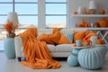 White interior, couch with light blue and orange blanket, pillows and vases Royalty Free Stock Photo