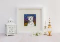 White interior display. Framed smiling Staffy dog collaged drawing.