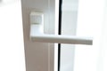 White interior handle in pvc or plastic material. Detail of a door Royalty Free Stock Photo