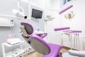 Dental unit with violet chair Royalty Free Stock Photo