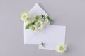 Invitation card mockup from paper blank and envelope decorated with flowers in minimal elegant style. Beautiful floral template