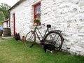 White irish cottage with cat chickens and bike Royalty Free Stock Photo