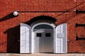 White iron gate with red brick wall old loft warehouse Royalty Free Stock Photo