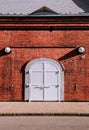 White iron gate with red brick wall old loft warehouse Royalty Free Stock Photo