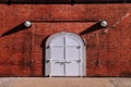 White iron gate with red brick wall old loft warehouse Royalty Free Stock Photo