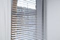 White iron shutters on the window. Installation of blinds Royalty Free Stock Photo