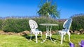 White iron table and chair in the Lavender garden. Royalty Free Stock Photo