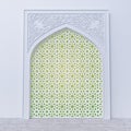 White Islamic Arch With Traditional Floral Design On Top And Arabesque Pattern Frame