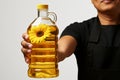 White isolated background, cooking hands with a sunflower oil bottle