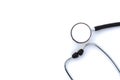 On a white isolated background lies a black stethoscope.