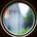 water drops on the glass wet window glass with splashes and drops of water Royalty Free Stock Photo