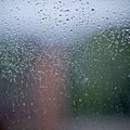 water drops on the glass wet window glass with splashes and drops of water Royalty Free Stock Photo