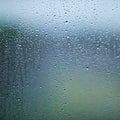 water drops on the glass wet window glass with splashes and drops of water Royalty Free Stock Photo