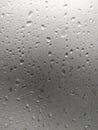 White isolated background water drops on the glass / wet window glass with splashes and drops of water. Texture autumn background Royalty Free Stock Photo