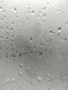 White isolated background water drops on the glass / wet window glass with splashes and drops of water. Texture autumn background Royalty Free Stock Photo