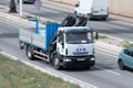 White Iveco Eurocargo crane truck circulating along the Ronda litoral de Barcelona