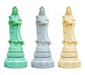 White, ivory and green statues of Guanyin hold a vase of holy water Royalty Free Stock Photo