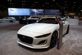 White Jaguar F-type sports car displayed at the Chicago Auto Show