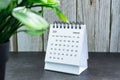 White January 2024 calendar on wooden desk. 2024 New Year Concept