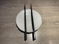 White japanese dish with chopstick on wooden table