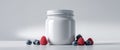 White Jar Mockup with Raspberries and Blueberries Royalty Free Stock Photo