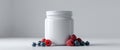 White Jar Mockup with Raspberries and Blueberries. Royalty Free Stock Photo