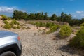 A white Jeep Renegade is parked on a dirt road. All wheel drive.